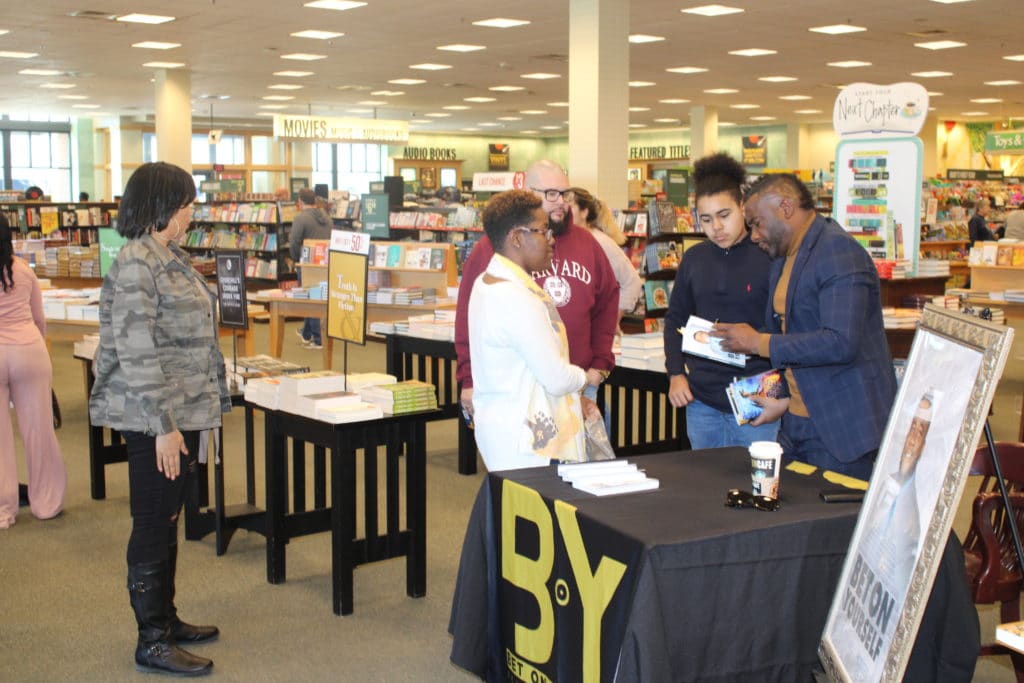 Dr. Hodges signing his book for customers